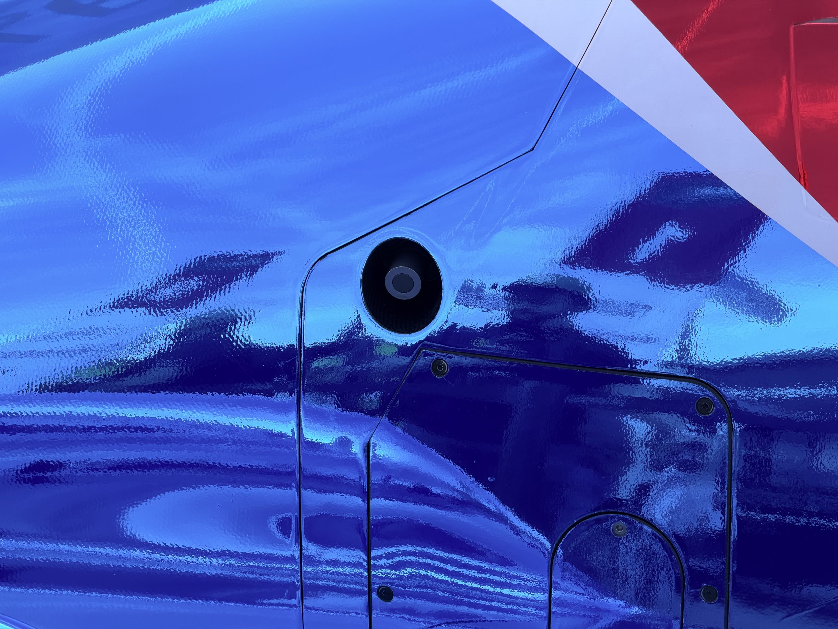 The immaculately shiny blue bodywork of an LMP2 car